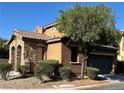 Beautiful exterior view featuring desert landscaping and a two-car garage at , Las Vegas, NV 89178