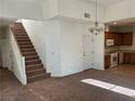 Open living space with staircase and view into the kitchen at , Las Vegas, NV 89178