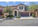 Charming two-story home featuring a well-manicured yard and attached two-car garage at 10135 Haymarket Peak Ave, Las Vegas, NV 89166