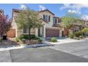Charming two-story home with a well-manicured yard and a two-car garage at 10135 Haymarket Peak Ave, Las Vegas, NV 89166