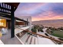 Expansive balcony with seating area offering panoramic views of the landscape at 11660 Summit Club Dr # 204, Las Vegas, NV 89135