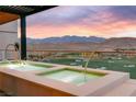 Stunning infinity pool with a beautiful view of the golf course and mountains at sunset at 11660 Summit Club Dr # 204, Las Vegas, NV 89135