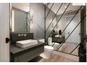 Modern powder room featuring unique mirrored wall design, floating vanity, and sleek fixtures at 11660 Summit Club Dr # 204, Las Vegas, NV 89135