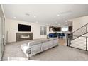 Open-concept living room with fireplace and abundant natural light at 11676 Midnight Melody Ave, Las Vegas, NV 89138
