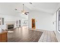 Open-concept living area with fireplace, ceiling fan, and ample natural light at 1911 Hobson Dr, Henderson, NV 89074