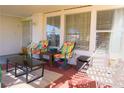 Relaxing covered patio featuring cozy seating and views of the backyard at 2801 Peggy Ave, Pahrump, NV 89048