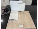 Interior design samples showing off a white cabinet, light countertop and plank at 3697 Alla Rocca Ave, Henderson, NV 89044
