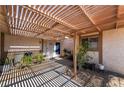 Inviting covered patio with stylish decor and ample natural light, perfect for outdoor relaxation at 405 Box Elder Way, Henderson, NV 89015