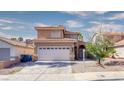 Inviting two-story home with tile roof, attached garage, and low-maintenance landscaping at 7329 Restful Springs Ct, Las Vegas, NV 89128