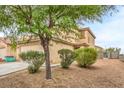 Charming two-story home with desert-friendly landscaping and an attached garage at 9626 Grapeland Ave, Las Vegas, NV 89148