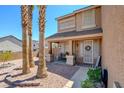 Inviting front porch with bench seating, decorative plants, and a welcoming entrance at 98 Milicity Rd, Henderson, NV 89012