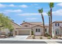 Charming two-story home featuring desert landscaping, a two car garage, and a welcoming entrance at 1557 Sabatini Dr, Henderson, NV 89052