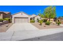 Single-story house featuring a two-car garage and well-maintained yard at 2131 Sandstone Cliffs Dr, Henderson, NV 89044