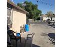 The backyard is a cement pad with some chairs at 2315 Perliter Ave, North Las Vegas, NV 89030