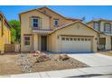 Two-story home with tan siding, desert landscaping, a two-car garage, and a tile roof at 3437 Visionary Bay Ave, North Las Vegas, NV 89081