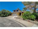 Charming home features a two-car garage and desert landscaping at 4280 Cicada Way, Las Vegas, NV 89121