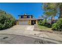 Charming home features a two-car garage and desert landscaping at 4280 Cicada Way, Las Vegas, NV 89121