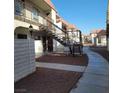 Exterior view of multi-Gathering units with desert landscaping and concrete walkways at 4300 N Lamont St # 232, Las Vegas, NV 89115