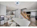 Open-concept dining area flows into the living space, featuring updated flooring and modern finishes at 5024 Starfinder Ave, Las Vegas, NV 89108