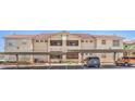 Condo building featuring covered parking with well-maintained landscaping at 520 Arrowhead Trl # 522, Henderson, NV 89015