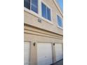 Close-up of exterior showing the unit number and the three-car garage at 5969 High Steed St # 101, Henderson, NV 89011