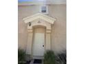 Entrance of townhome featuring unit number above a white front door at 5969 High Steed St # 101, Henderson, NV 89011