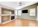 Bright living room with a fireplace, lots of natural light, and neutral-colored walls ready for decor at 6529 Sierra Diablo Ave, Las Vegas, NV 89130