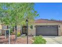 Charming single story home featuring a desert landscaped yard and decorative security screen door at 6647 Montezuma Castle Ln, North Las Vegas, NV 89084