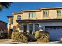 Charming two-story home featuring an attached garage and well-maintained landscaping at 7728 Villa De La Paz Ave, Las Vegas, NV 89131