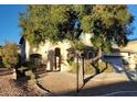 Charming two-story home with a well-manicured front yard and attached garage at 7728 Villa De La Paz Ave, Las Vegas, NV 89131