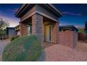Welcoming front porch with stone accents and desert landscaping at 8 Reflection Cove Dr, Henderson, NV 89011