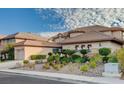 Charming home with a meticulously landscaped front yard, showcasing mature plants and an oversized driveway at 10829 Ickworth Ct, Las Vegas, NV 89135