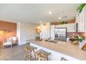Modern kitchen with stainless steel appliances and eat-in island at 10982 Rollingford Ave # Lot 7, Las Vegas, NV 89166