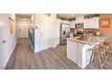 Spacious kitchen area with stainless steel appliances, lots of cabinets and eat-in counter space at 10982 Rollingford Ave # Lot 7, Las Vegas, NV 89166