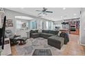 Spacious living room featuring a large sectional, neutral decor, and open layout at 11023 Ketchikan St, Las Vegas, NV 89179