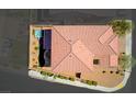 Bird's eye view of the home's roof, backyard with hot tub, and desert landscaping at 1172 Strada Pecei, Henderson, NV 89011