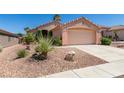 Charming single-story home showcasing a well-kept yard and attached two-car garage at 2101 High Mesa Dr, Henderson, NV 89012