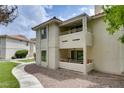 A two-story condo exterior with private balconies and desert landscaping at 2633 S Durango Dr # 202, Las Vegas, NV 89117