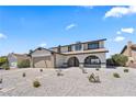 Charming two-story home featuring a two-car garage and low-maintenance desert landscaping at 307 Balsa St, Henderson, NV 89002