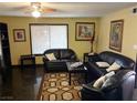 Inviting living room with comfortable seating and a large window, creating a bright and welcoming atmosphere at 3167 El Cedro Cir, Las Vegas, NV 89121