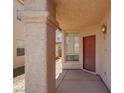 View of front door with neutral color and large pillar for support at 3359 Commendation Dr, Las Vegas, NV 89117