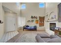Bright living area with a fireplace, vaulted ceiling and lots of natural light at 3359 Commendation Dr, Las Vegas, NV 89117