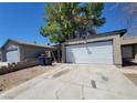 Detached two-car garage with large driveway at 3755 Chutney St, Las Vegas, NV 89121