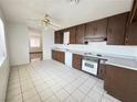 Bright kitchen featuring tiled floors and wood cabinets at 4303 Paramount St, Las Vegas, NV 89115