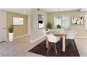 Dining room featuring a wood table with seating for six and neutral decor at 4687 Madreperla St, Las Vegas, NV 89121