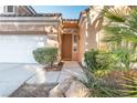 Close up of the front entrance with desert landscaping and a walkway at 4760 Verdet St, Las Vegas, NV 89147