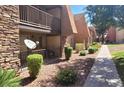 Inviting exterior showcases a well-maintained community with lush landscaping and sidewalk at 5295 Indian River Dr # 305, Las Vegas, NV 89103