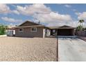 Quaint single-story home showcases a generously sized front yard and covered parking at 922 Westminster Ave, Las Vegas, NV 89119
