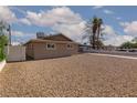 Spacious front yard presents a serene view of this single-story residence at 922 Westminster Ave, Las Vegas, NV 89119