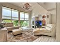 Bright living room with large windows, chandelier, and a tile floor at 940 Vegas Valley Dr, Las Vegas, NV 89109